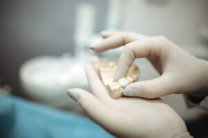 Dental lab technician creating a crown