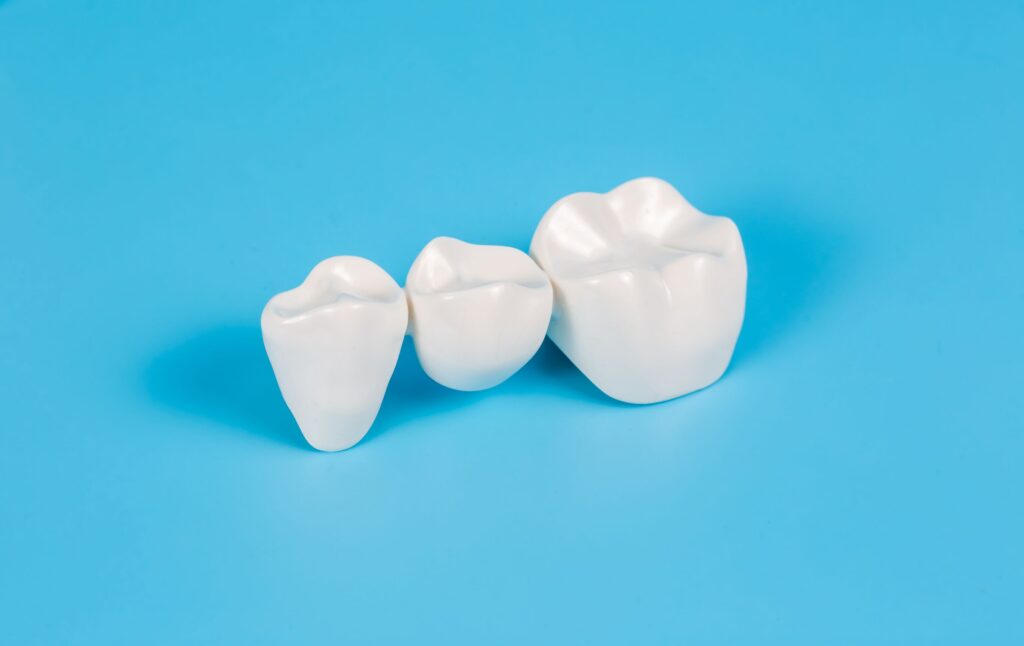 Dental bridge on a light blue background